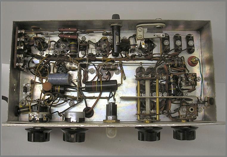 bottom view of small desk-top receiver showing all the small parts