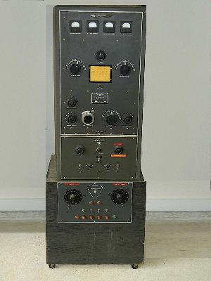 Lrge gray radio transmitter with 4 meters and many knobe - Probable 4 feet high