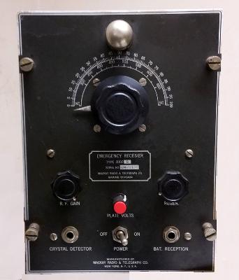 Small gray radio with 3 controls