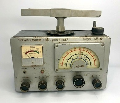 Direction-finding radio receiver with 5 knobs, tuning dial and meter on front and loop antenna on top