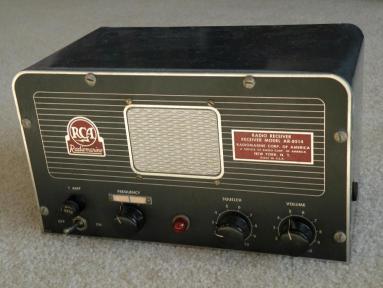 Shipboard receiver with 3 knobs and a center mounted speaker