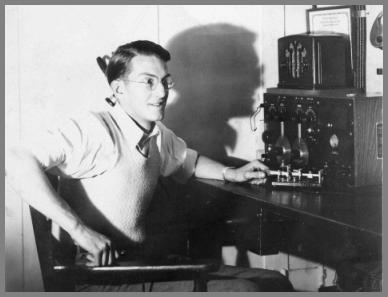 Young man with glassses in ship radio room