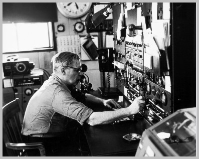 B & W photo of operator at the control board of radio station WAD in 1963