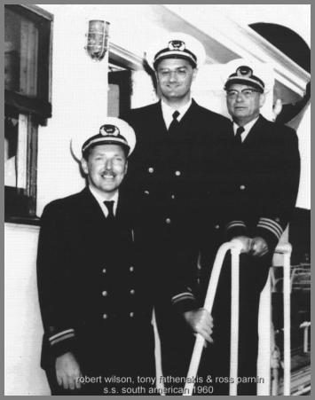 Three radio operators in uniform just outside the Radio Room of the SS South American