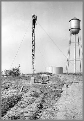 Workning on the gantry used to raise the vertical antenna.